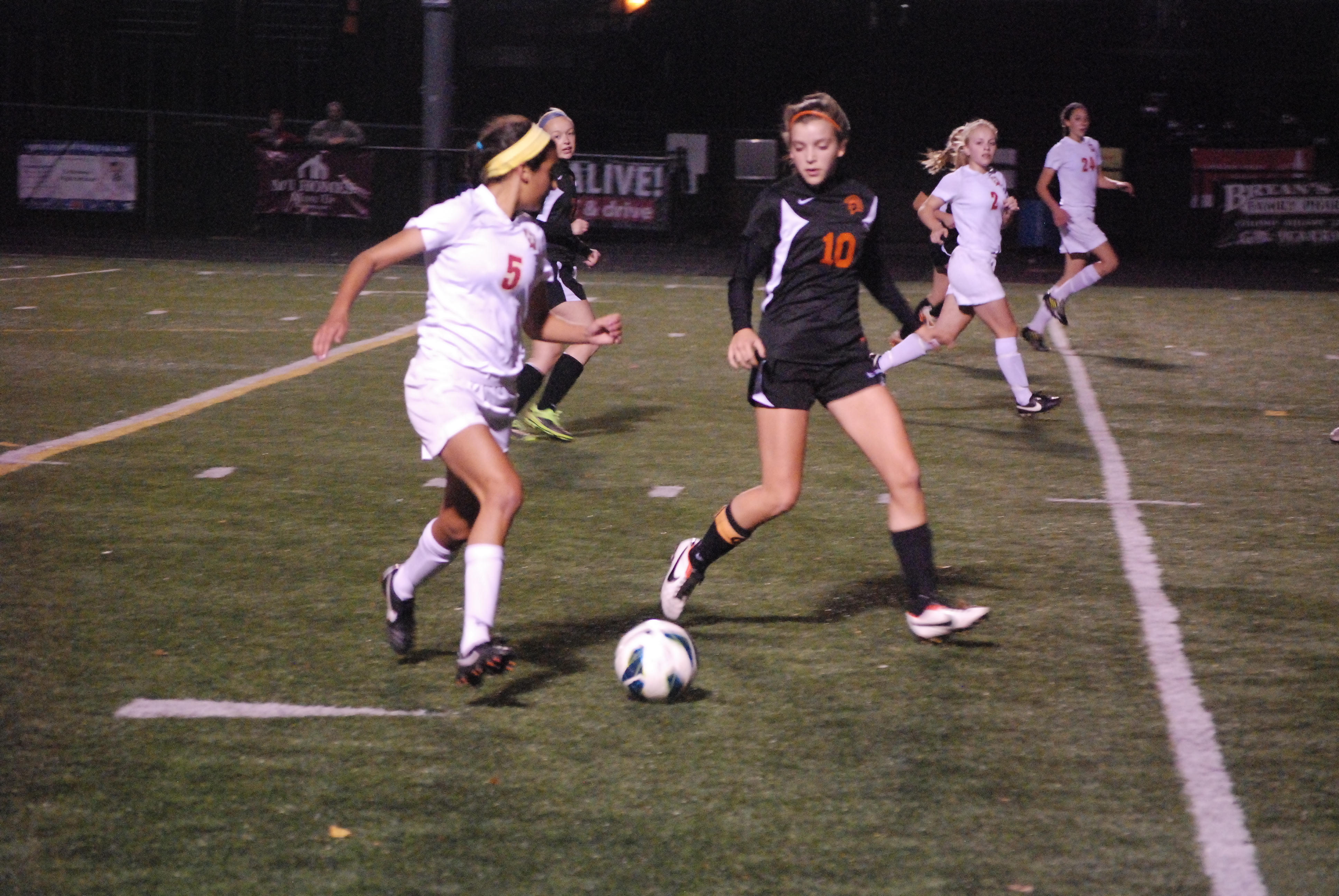 Fenwick sophomore Alisha Himes works the ball upfield during the first half of a Division III sectional final against Lebanon on Monday night. The Falcons won the game 1-0 to advance to Thursday's district championship.