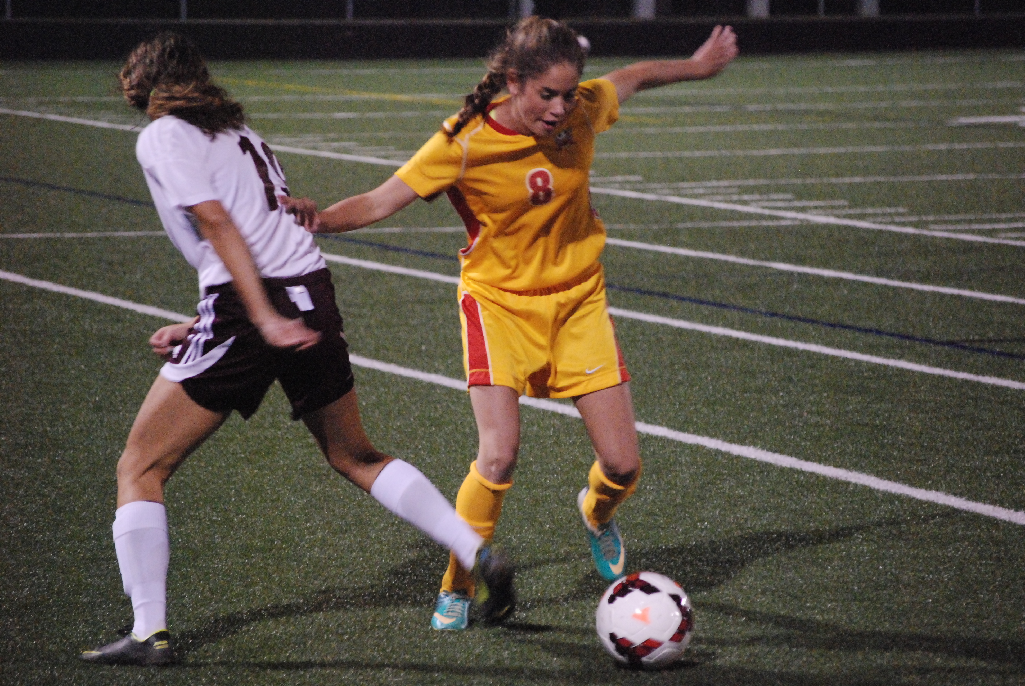 Fenwick sophomore Taylor Engle wins a ball against Columbus Academy sophomore Lily Rizk during first-half action the Division III regional semifinal match Tuesday night at Hilliard Bradley High School. Fenwick won the game 2-0 to advance to Saturdays regional final.