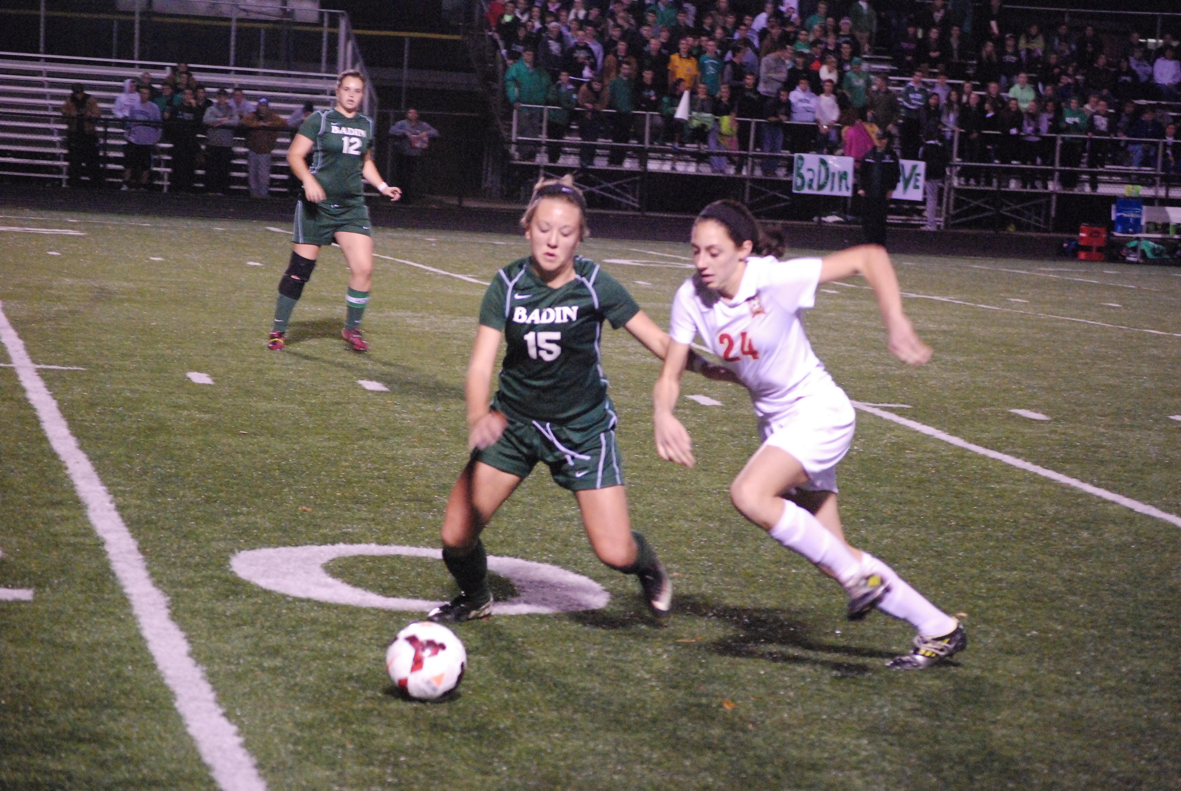 Fenwick freshman Erica Hafer (24) and Badin sophomore Shelby Lamping (15)  chase down a loose ball during the Division III state semifinal contest Tuesday night in Lebanon.